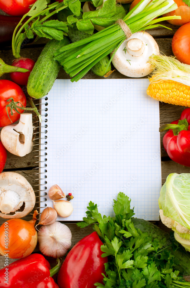 Open Notebook and Fresh Vegetables Background. Diet