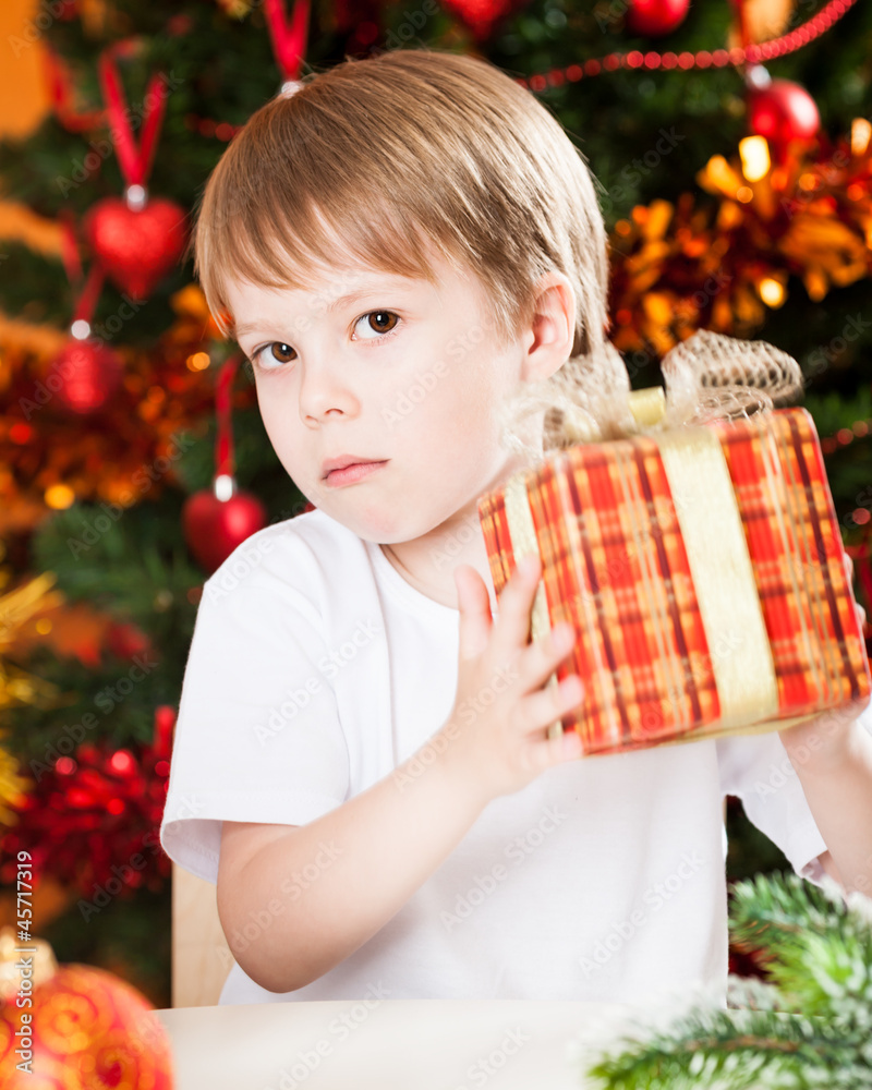 Boy holding Xmas gift