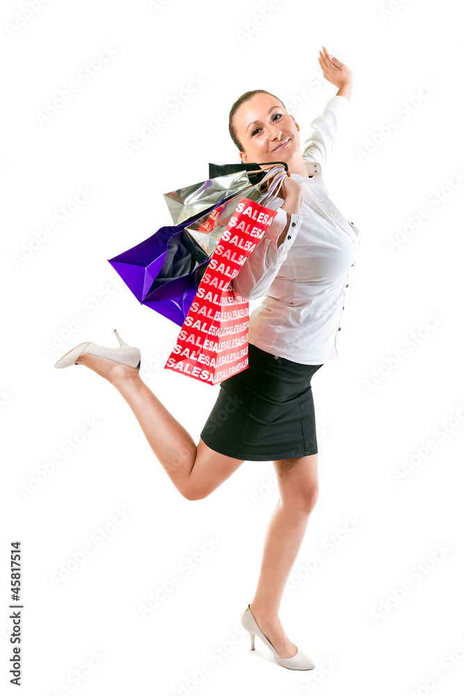 Attractive young female holding shopping bags