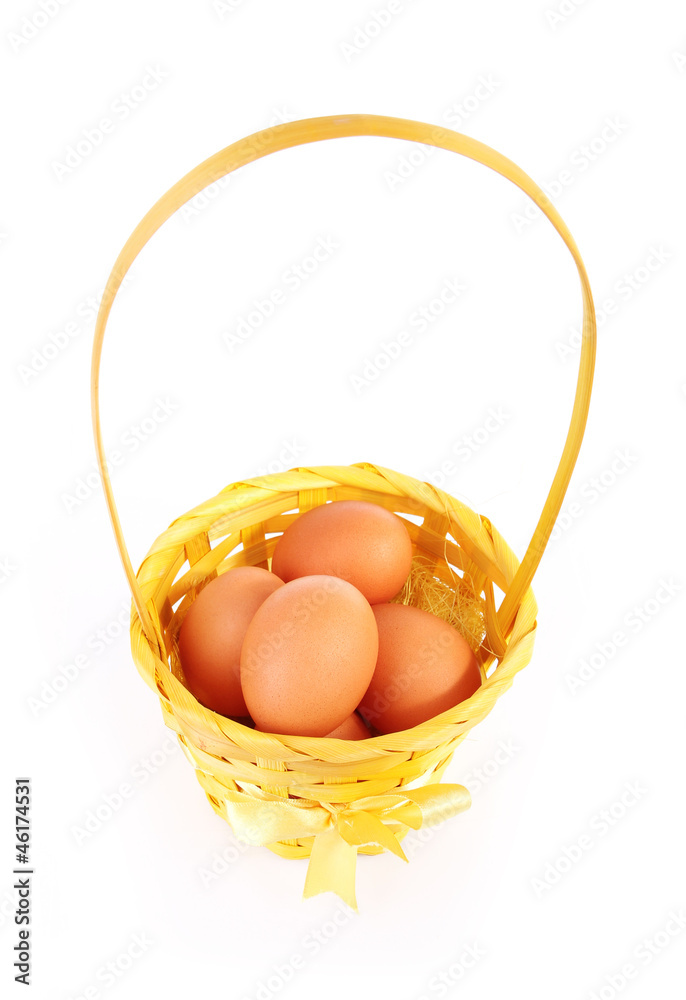 eggs in beautiful basket isolated