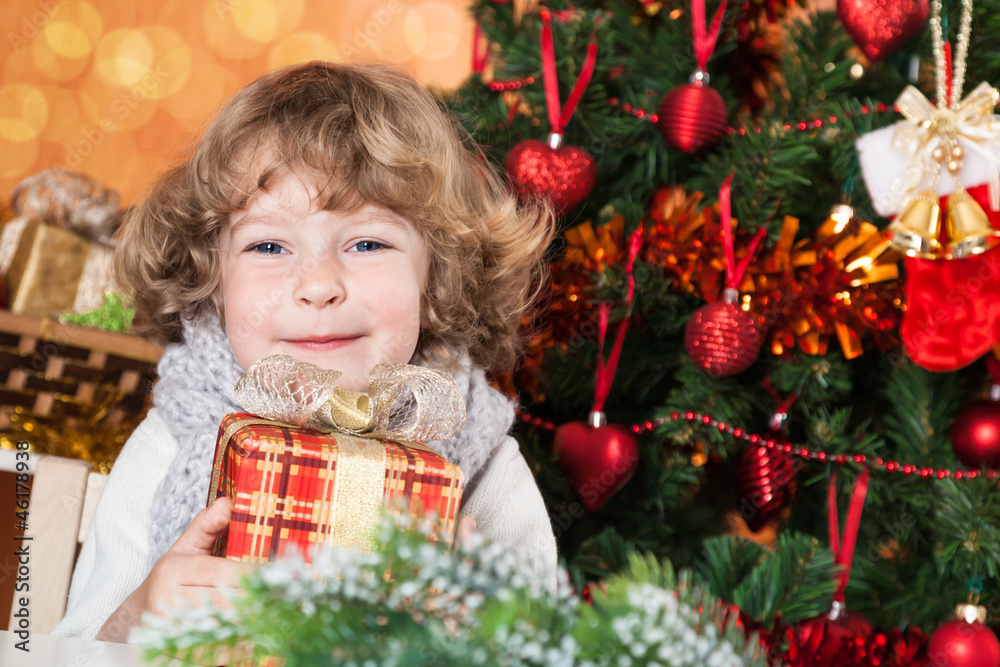 Happy child holding present