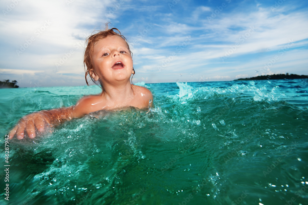 Two year old kid swimming