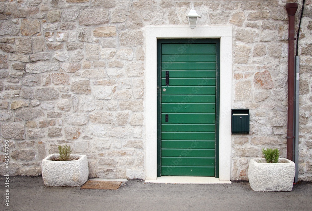 Green door in old stone house