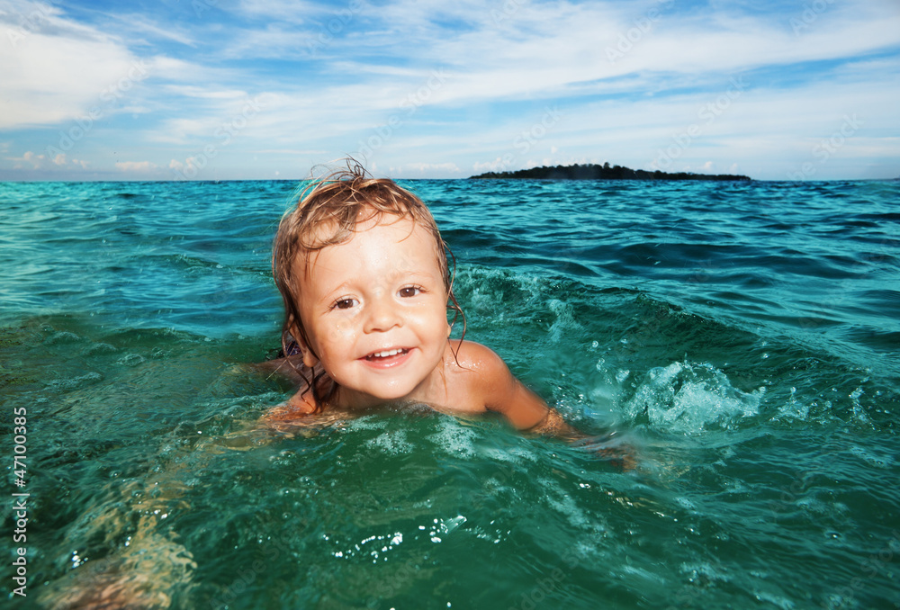 Kid swimming in the sea