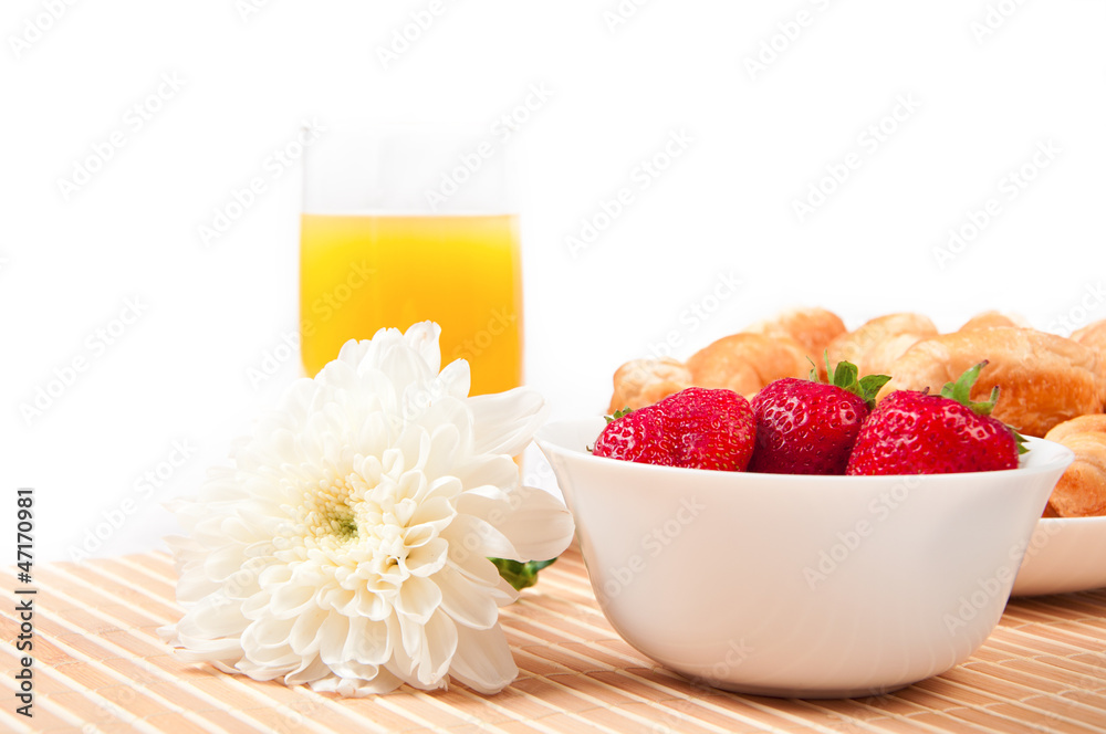 Breakfast with berries,orange juice and croissant