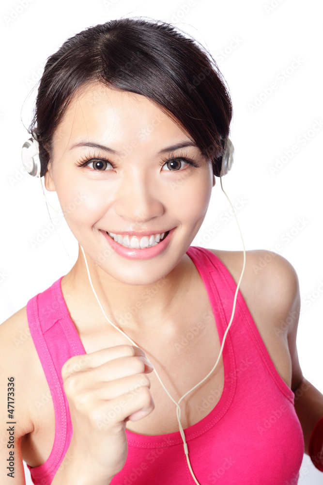 woman in sport wear listening music