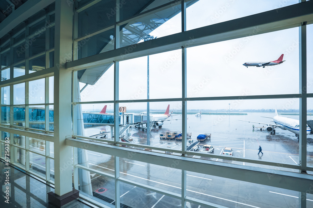 airport outside the window in rain