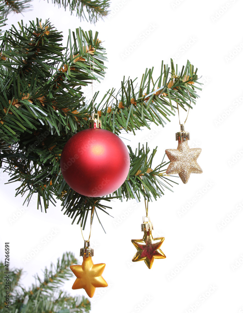 red ball and gold stars on Christmas tree branch, isolated