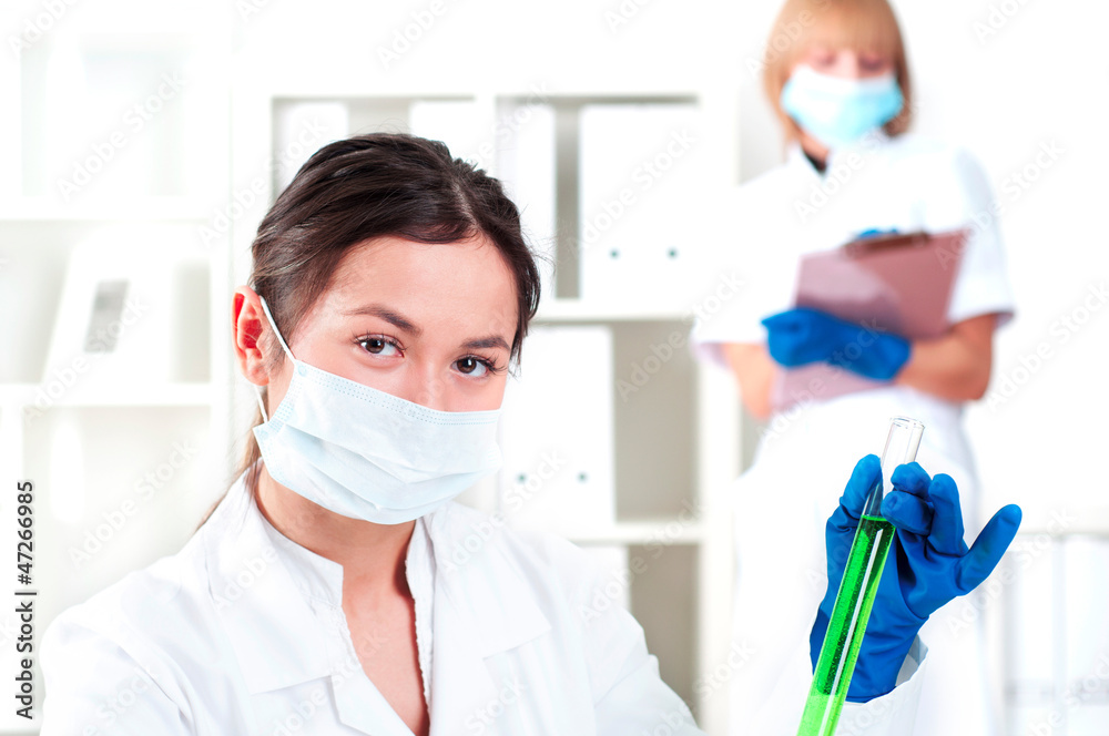 female chemist with test tube