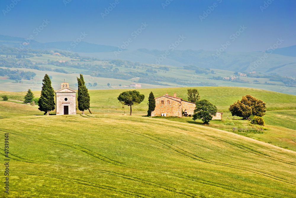 Tuscany landscape with chapel on a hill in Val dOrcia, Italy