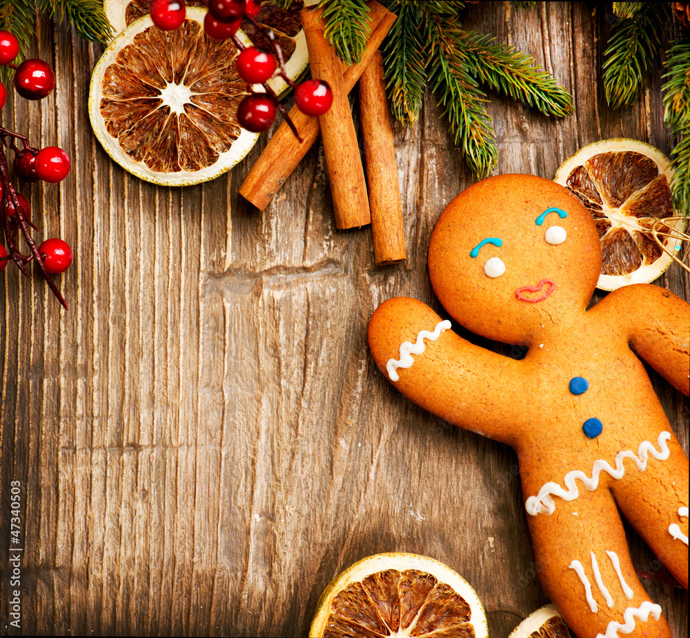 Christmas Holiday Background. Gingerbread Man over Wood