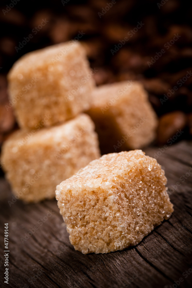 Macro shot of brown sugar on wooden surface