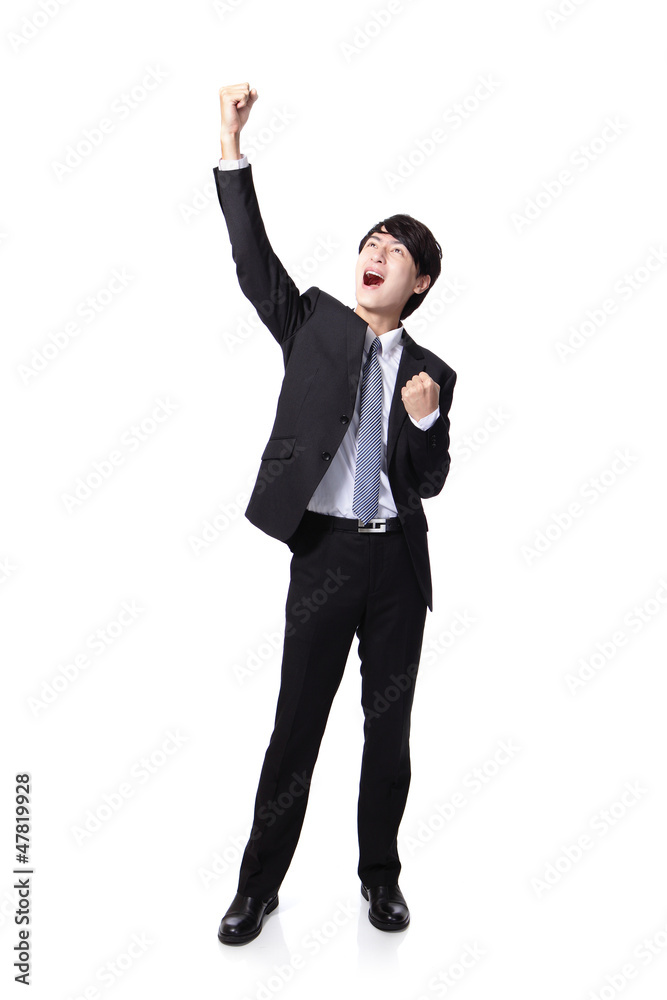 Excited business man with arms raised