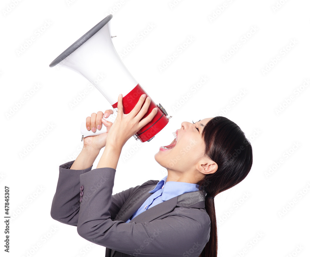 Business woman angry screaming loudly in a megaphone