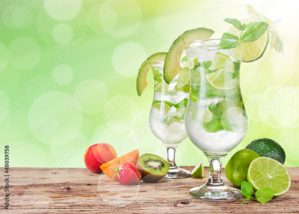 Fresh mojito drinks on wooden table