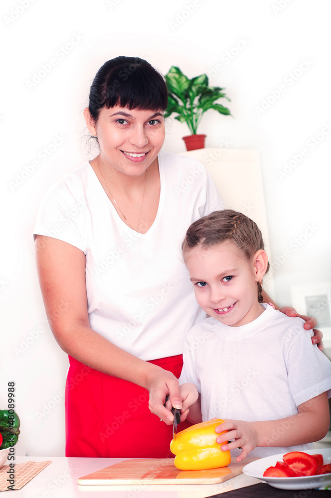 mom and daughter cooking together