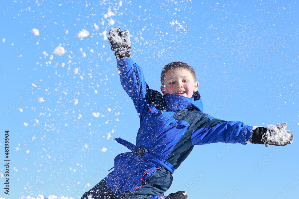 boy having fun with snow