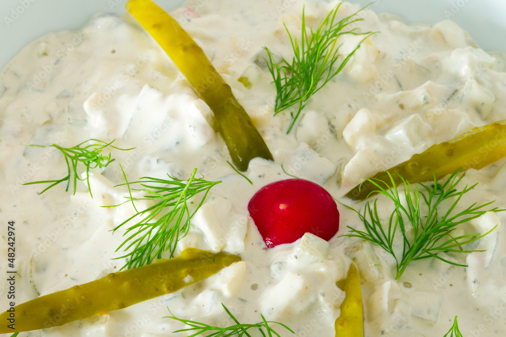 Homemade potato and vegetables salad with mayonnaise