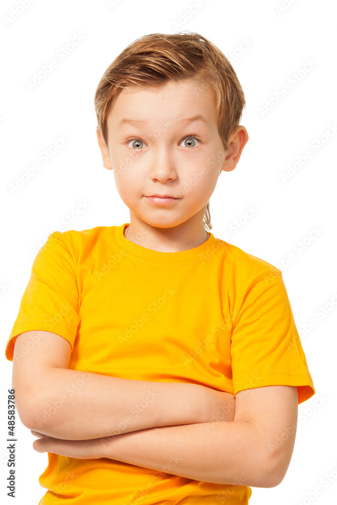 Puzzled boy in yellow t-shirt