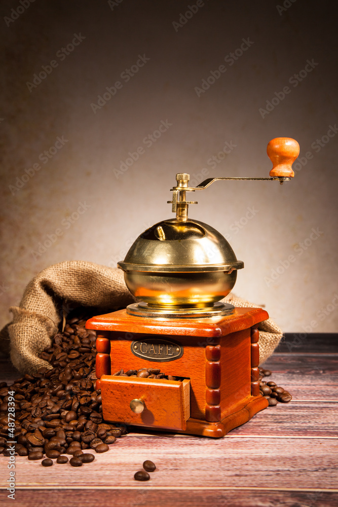 Coffee still life with wooden grinder