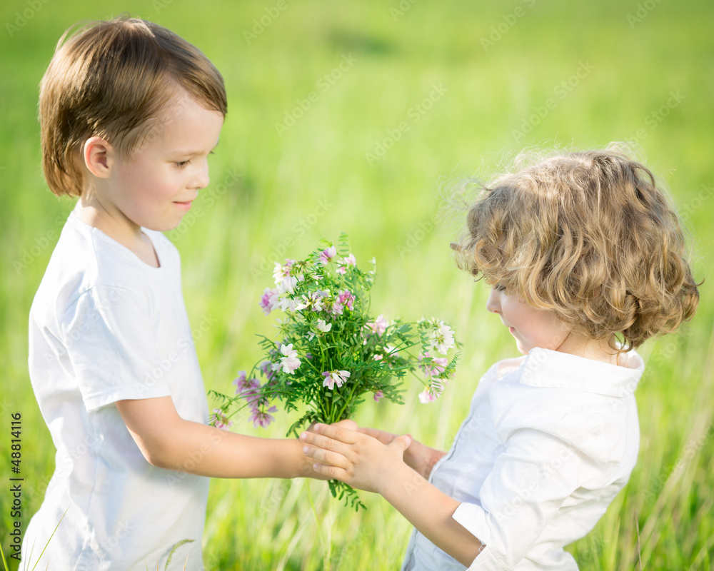 Smiling boy giving bouquet