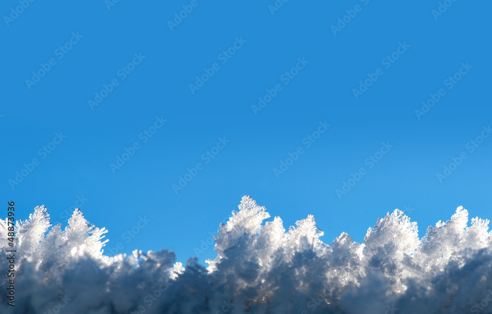 snow crystals on blue sky