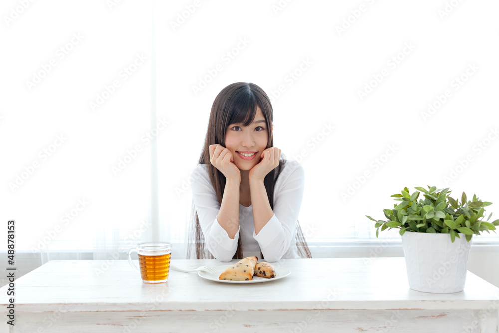 attractive asian woman eating sweets