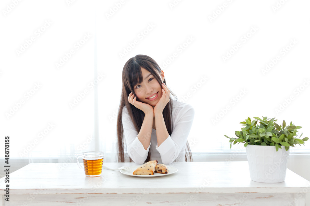 attractive asian woman eating sweets