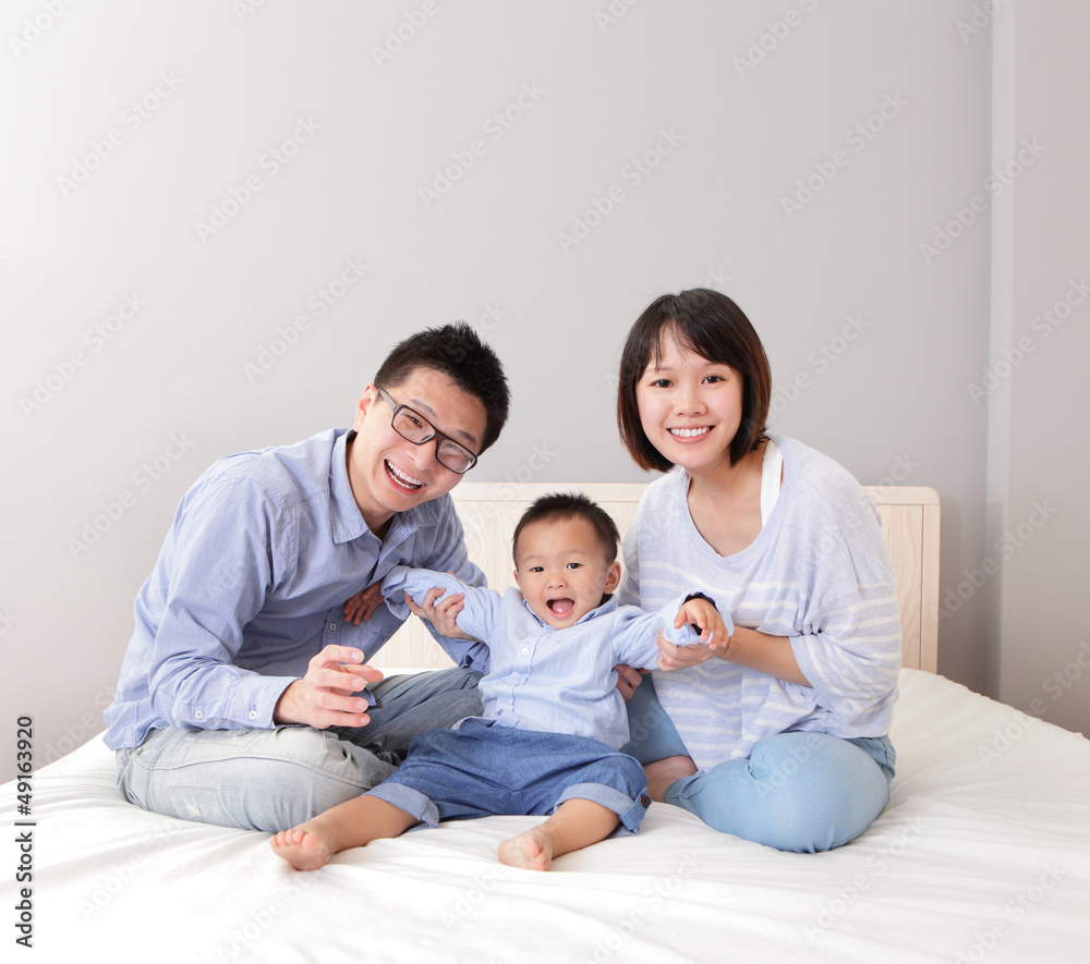 happy family play on bed