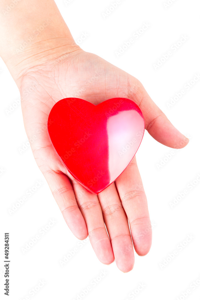 Heart in hand as love and health symbol