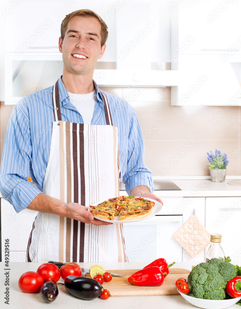 Young Man Cooking Pizza