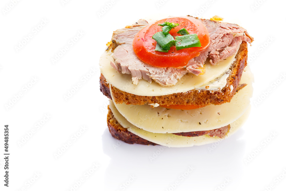 Sandwich with roast pork, cheese and tomato