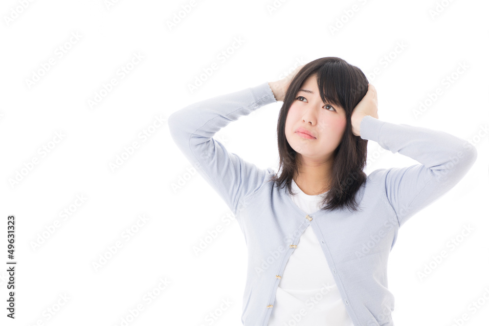 a worred young asian woman on white background