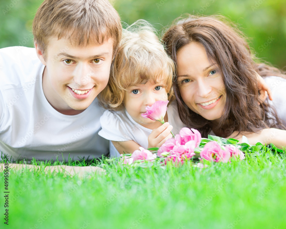 Happy family with bouquet of spring flowers