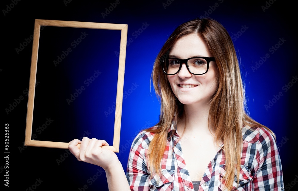 Smiling woman with nerd glasses holding frame