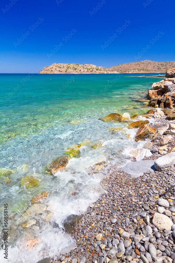 Turquise water of Mirabello bay with Spinalonga island on Crete