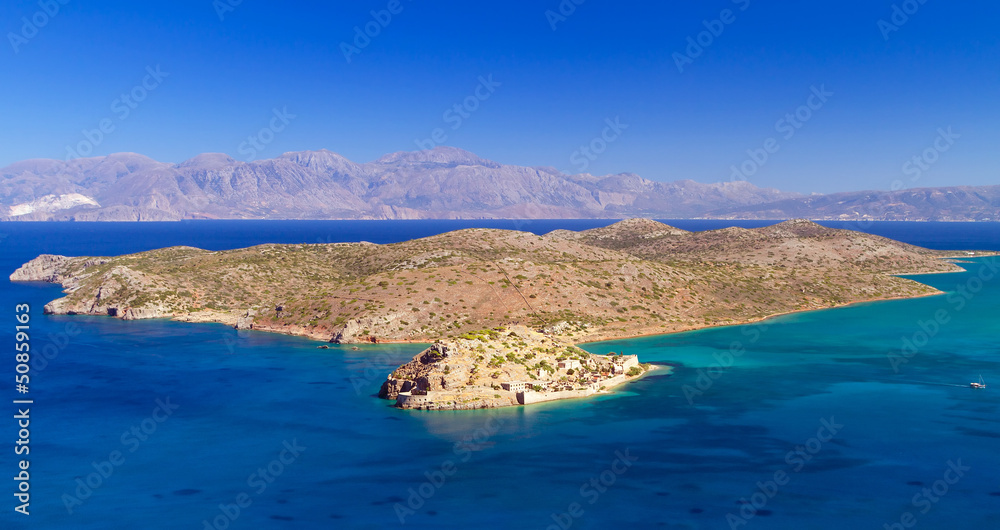 Turquise water of Mirabello bay with Spinalonga island on Crete