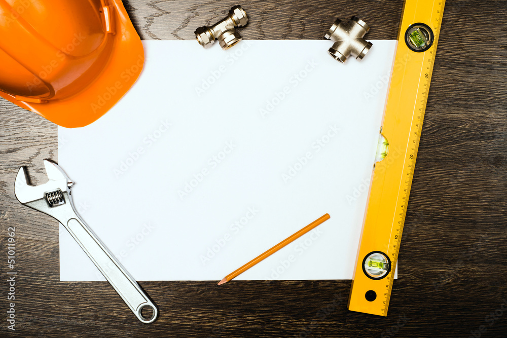 plumbing tools on a white sheet of paper