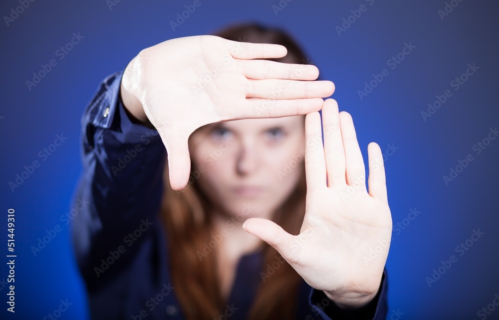 Woman two hands framing composition, forming space