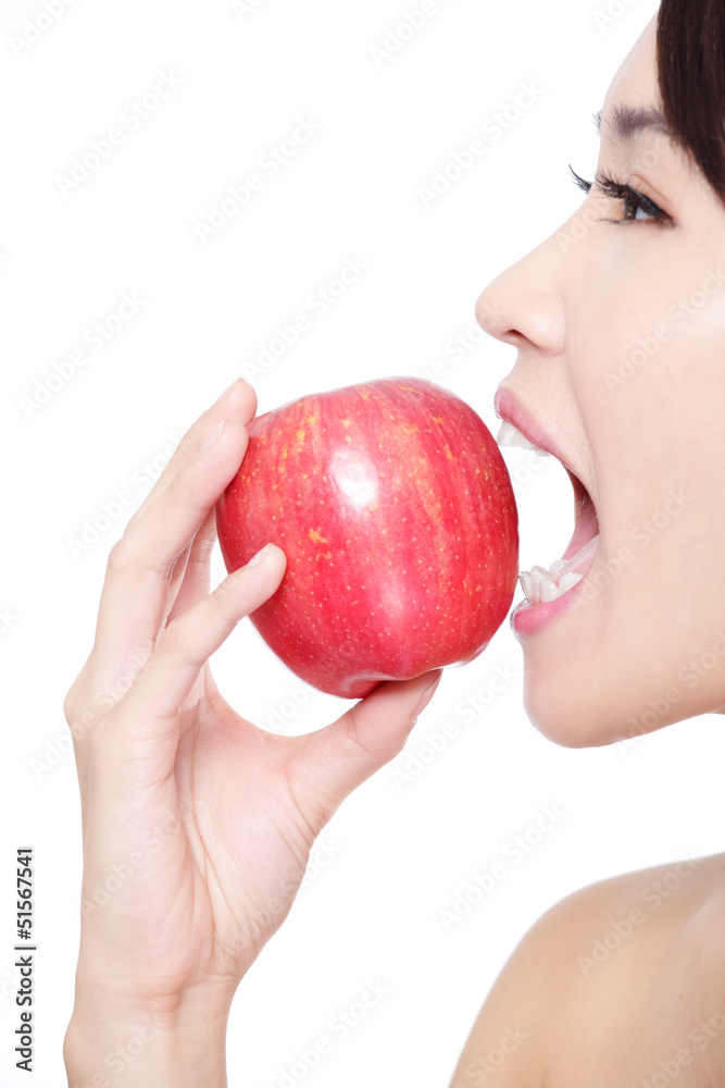 young woman eating red apple with health teeth