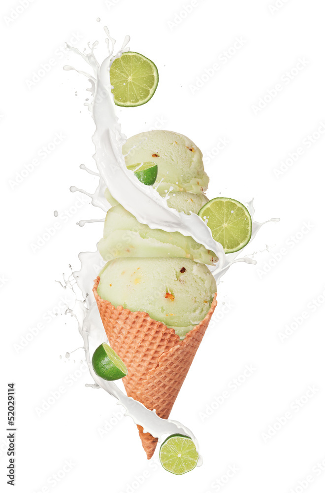 Ice cream with milk splash and pieces of fruit on white backgrou