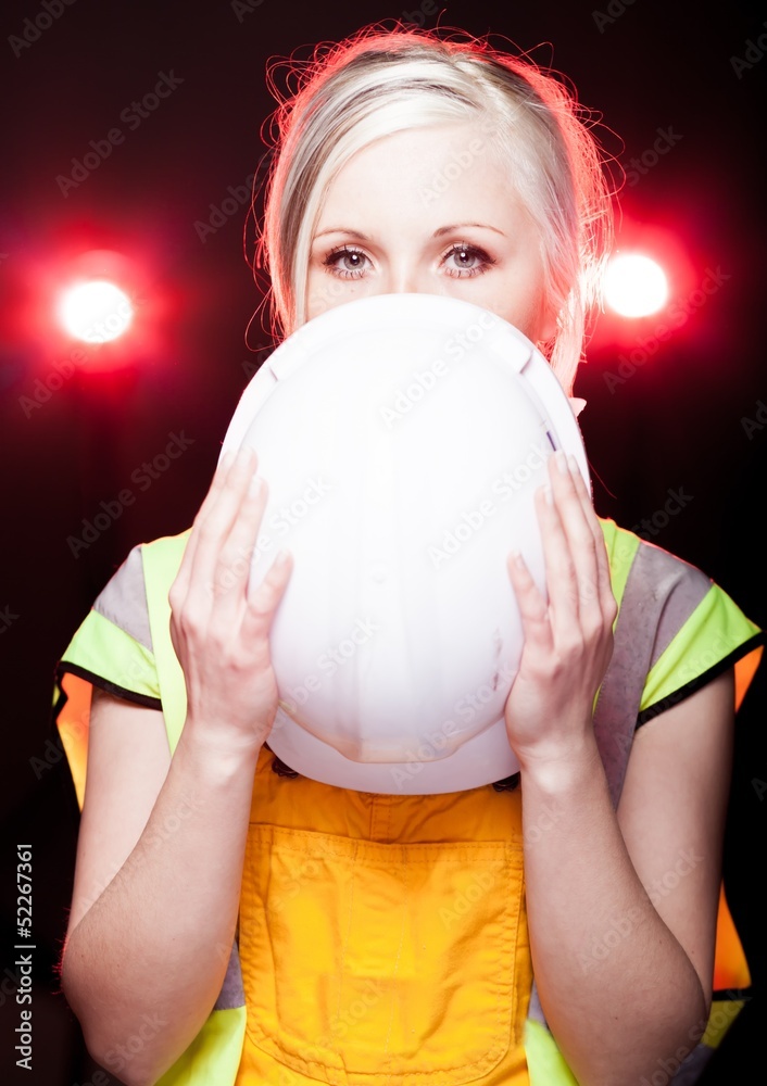 Young architect woman construction worker, safety helmet