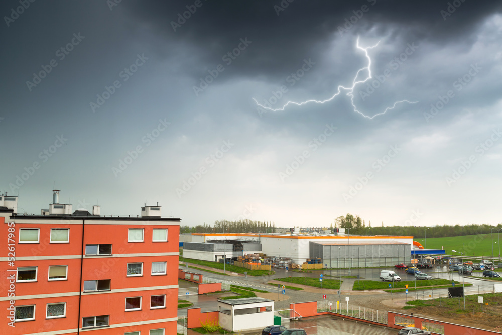 Summer thunderstorm over city buildings in Poland