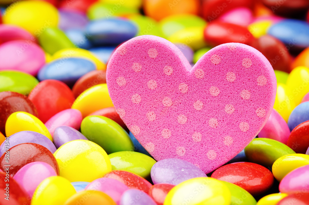 Pink heart and colorful smarties