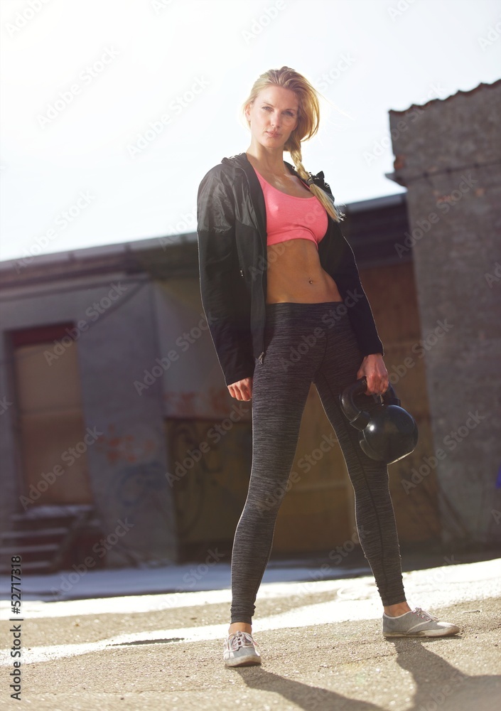 Crossfit Woman Lifting a Kettlebell