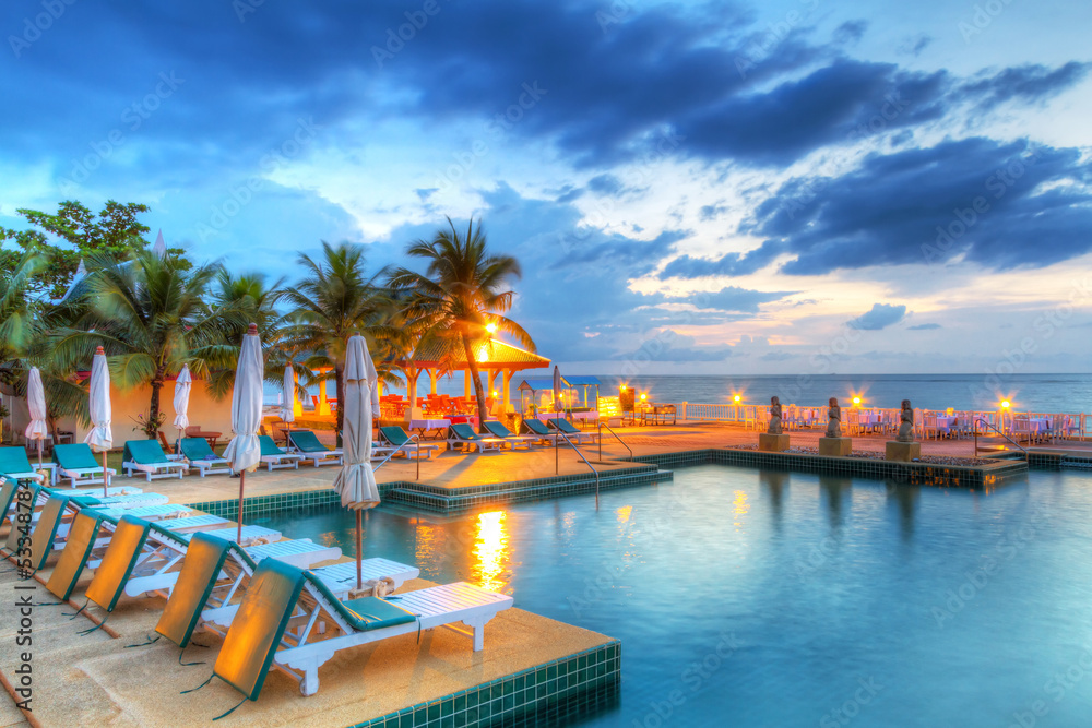 Sunset at swimming pool in Thailand