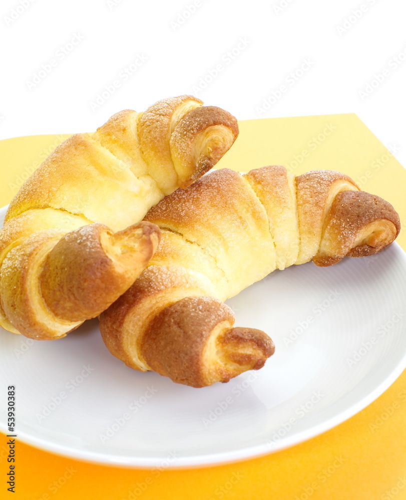 Fresh and tasty croissant over white background