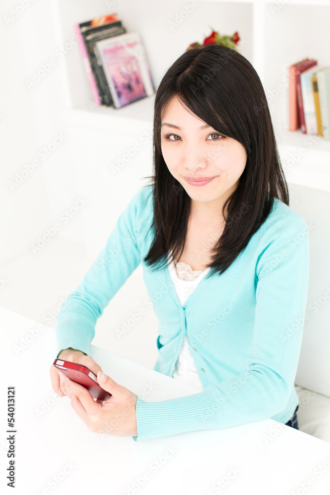 attractive asian woman relaxing in the room