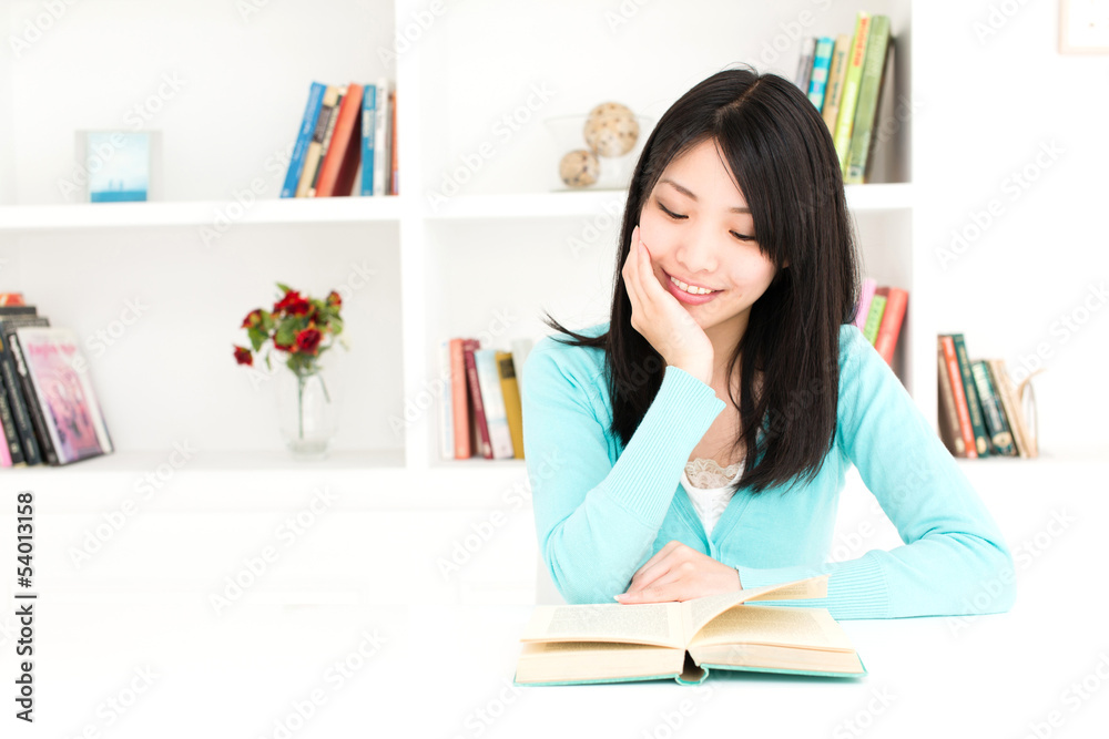 attractive asian woman reading book in the room