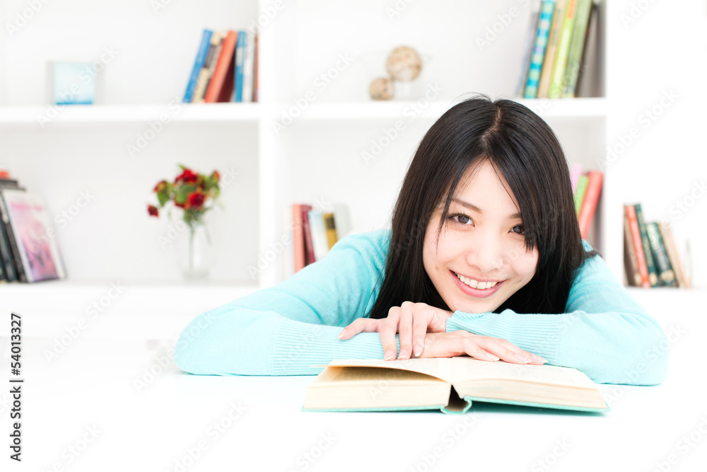 attractive asian woman reading book in the room